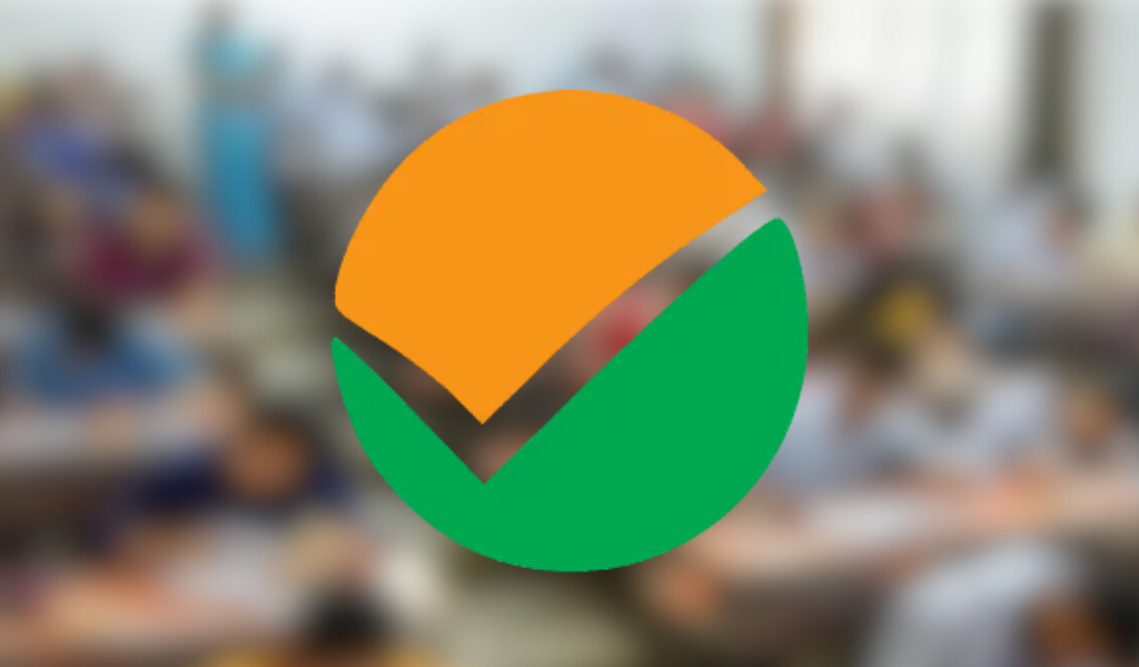 NEET exam logo displayed over a blurred classroom background